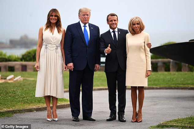 French President Emmanuel Macron (2nd R), his wife Brigitte Macron (R), US President Donald Trump (2nd L) and his wife US First Lady Melania Trump (L) pose for a photograph ahead of a working dinner