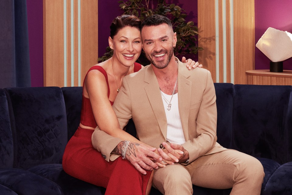Emma Willis and Matt Willis sitting on a couch.