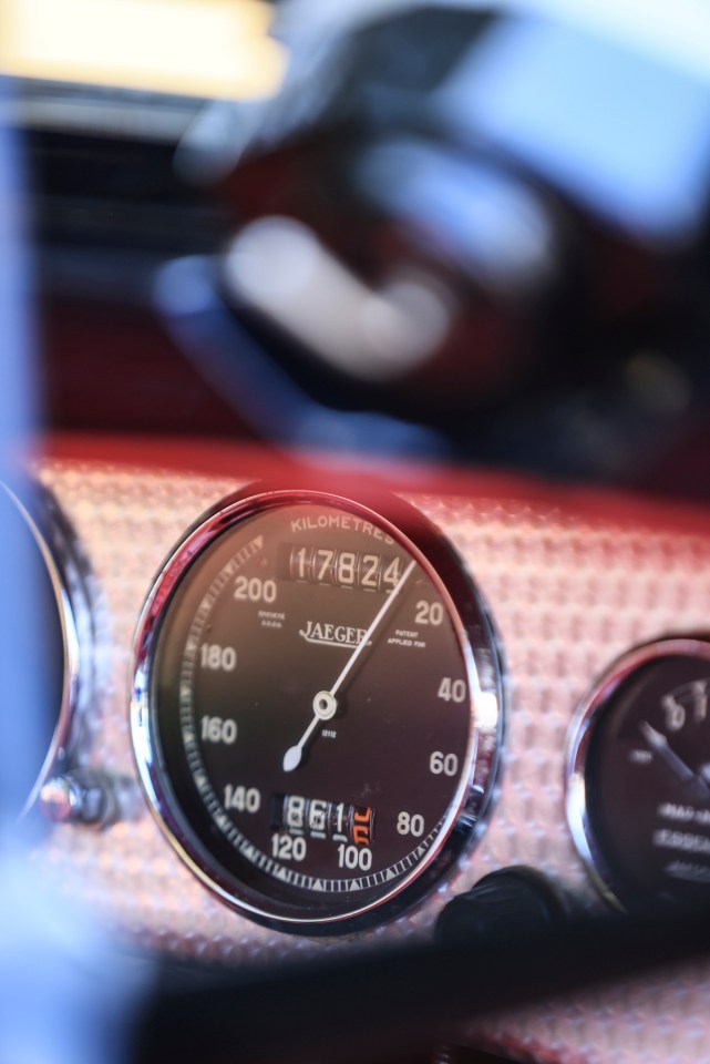 Close-up of a classic car's speedometer showing 17824 kilometers.