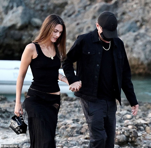Despite the warm temperatures, Leonardo wrapped up in a black jacket