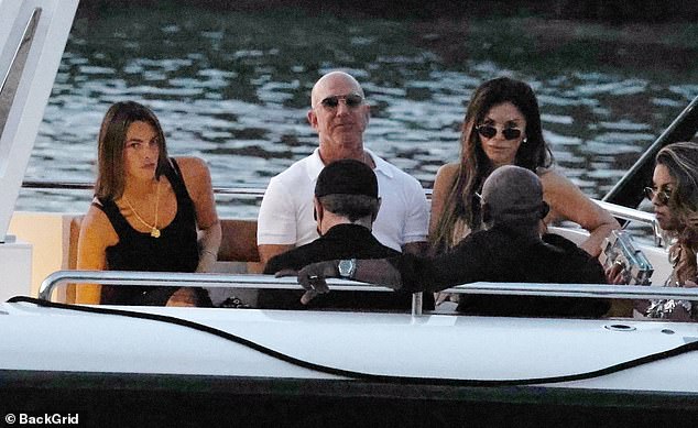 The gang looked serious in another shot as they headed to shore