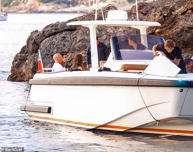 The group came to shore in a smaller boat after departing their yacht