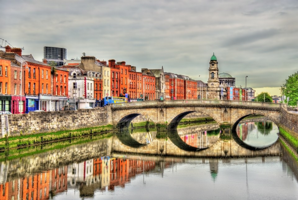 Mellows Bridge reflecting in the Liffey River, Dublin.