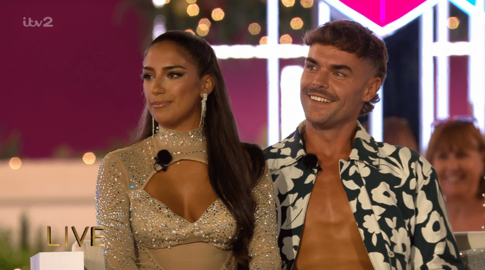Screenshot of a man and woman sitting together on a live television show.