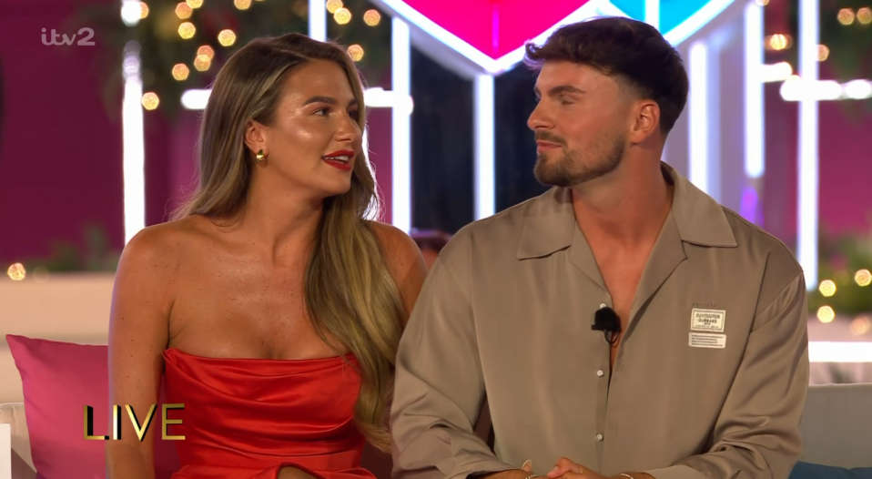 Screenshot of a man and woman on a live TV show.