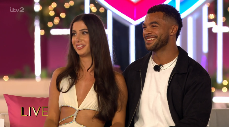 Screenshot of a man and woman on a live TV show.