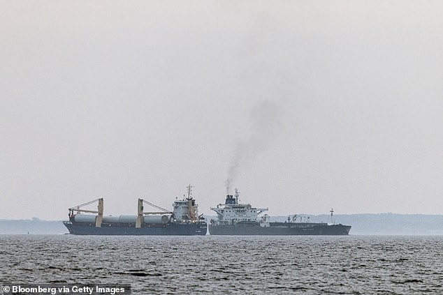 The shadow fleet tanker Turbo Voyager, right, passes within 600 meters of a general cargo vessel as it transits through the Great Belt of Denmark off the coast of Agerso, Denmark, on Thursday, Aug. 15. 2024