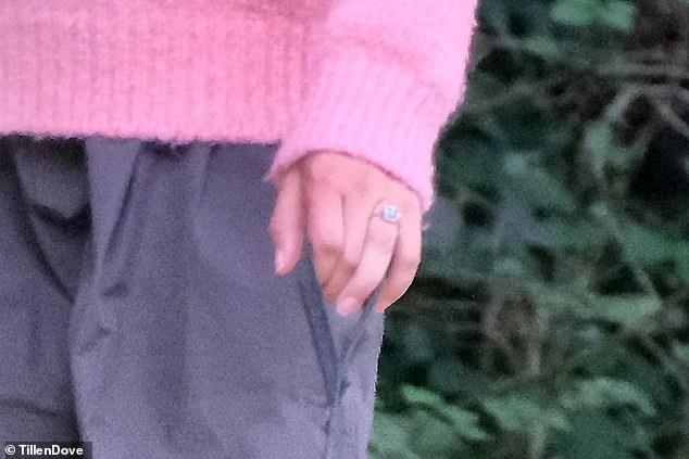 Her stunning ring is a 5.02-carat, east-west cushion-cut diamond, set in a Georgian-style cut-down setting