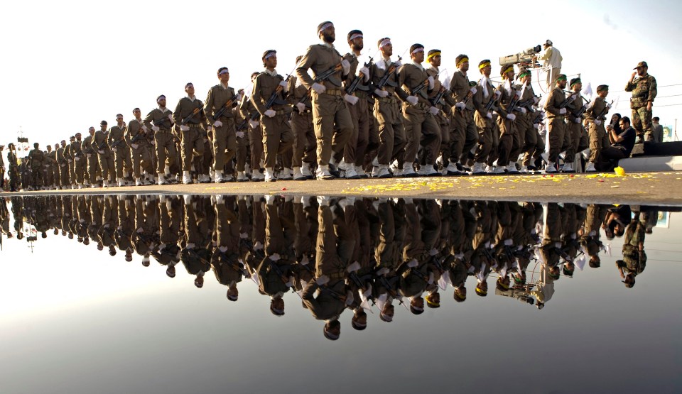 Iranian Revolutionary Guards marching in a military parade.