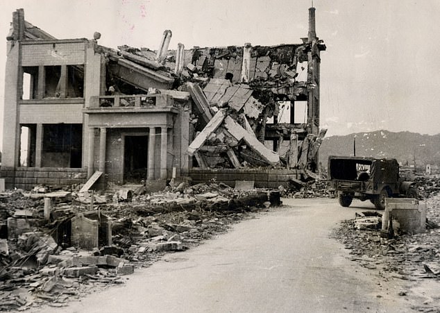The collapsed roof of a reinforced concrete building is pictured amidst the devastation in Hiroshima