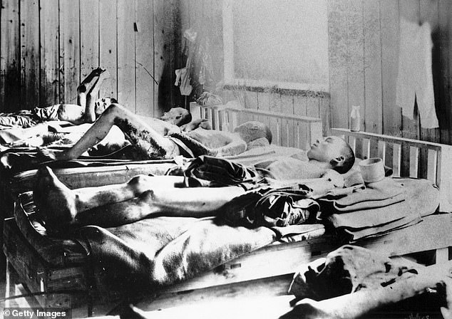 Survivors of the Hiroshima attack are seen lying on beds, stricken by radiation
