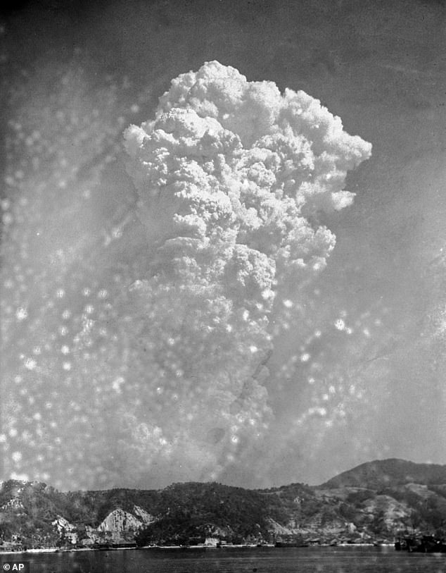 A view from the ground of the enormous cloud rising above Hiroshima after the detonation of atom bomb Little Boy