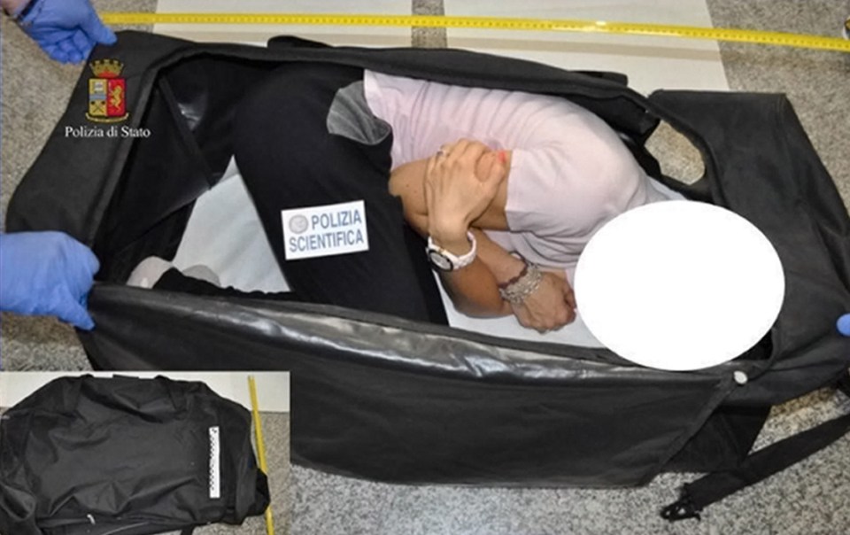 Police reconstruction of a kidnapping; a woman in a suitcase.
