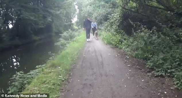 Footage from her bike camera shows the cyclist braking in front of the pair as one of them appears to shout for her to 'slow down'
