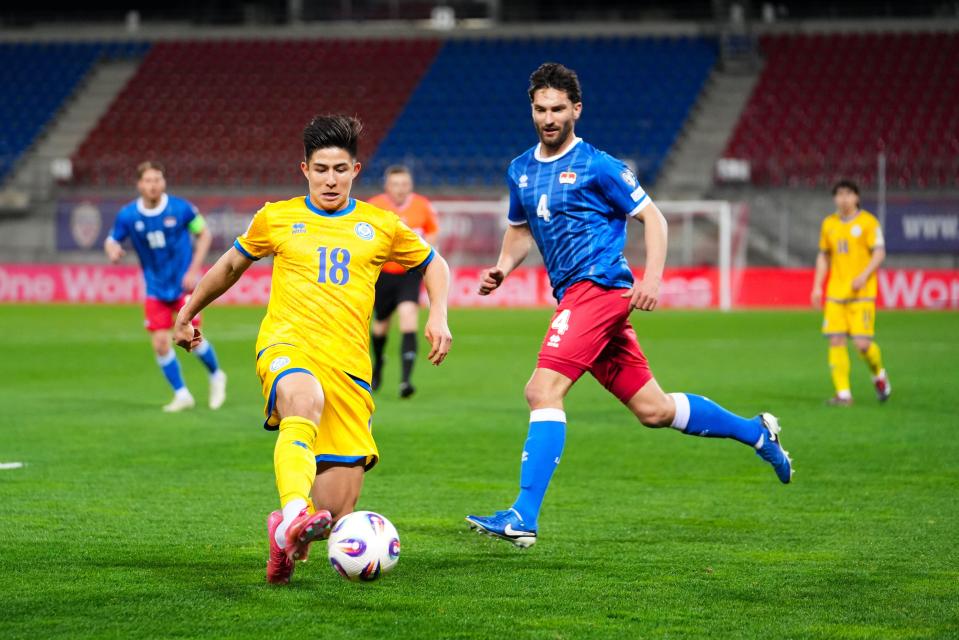 Soccer players competing in a match.