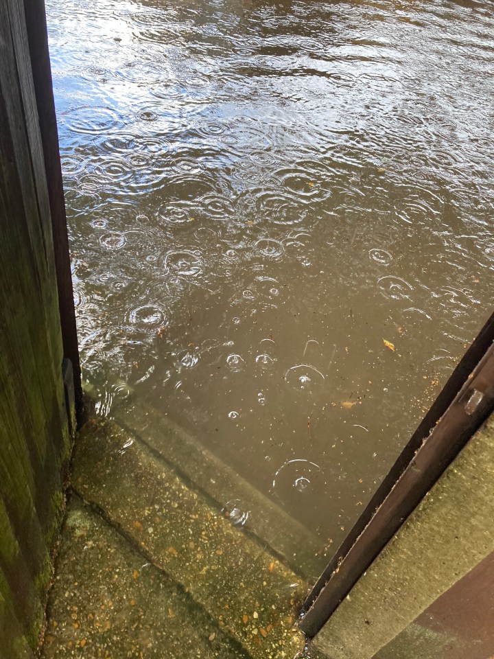 Flood water covering a paved area.