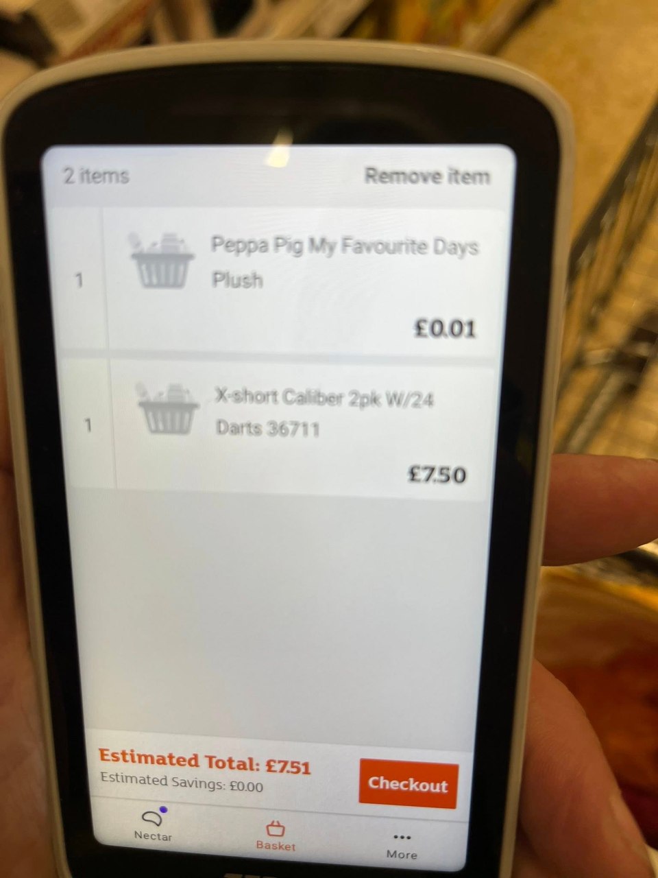 Self-checkout screen showing a Peppa Pig plush toy costing £0.01 and darts costing £7.50.