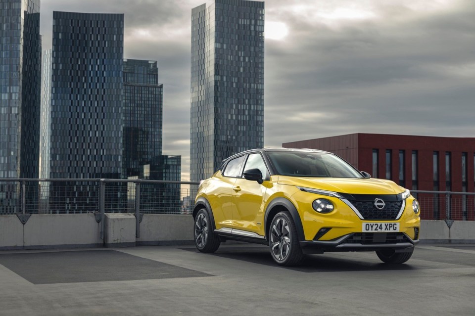 Yellow Nissan Juke parked on a rooftop.