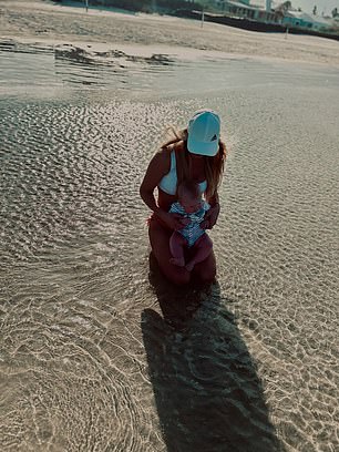 Her two young children could be seen taking a splash