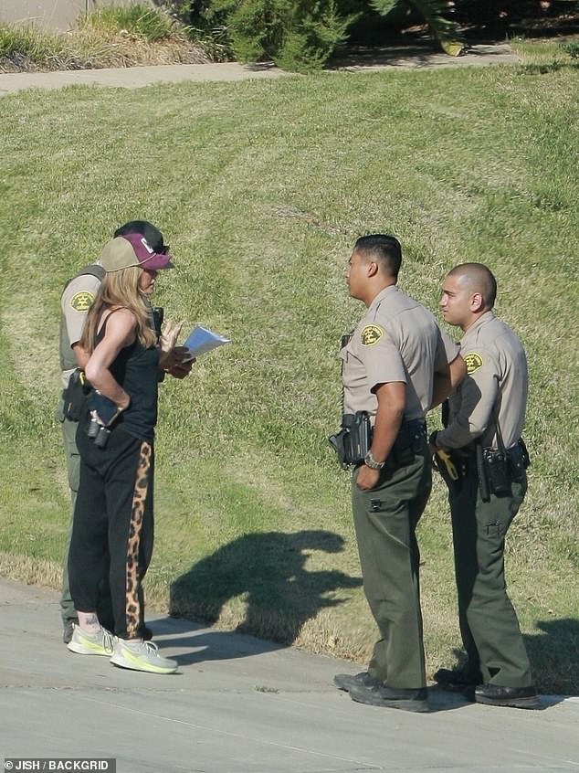 Richards chatted with officers outside of the home