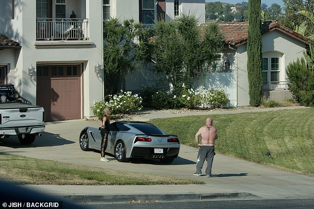 Aaron's brother Brett was also present, standing by Richards' parked Corvette as they waited for police
