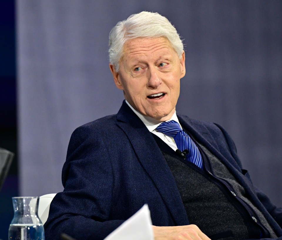 Bill Clinton speaking at a conference.