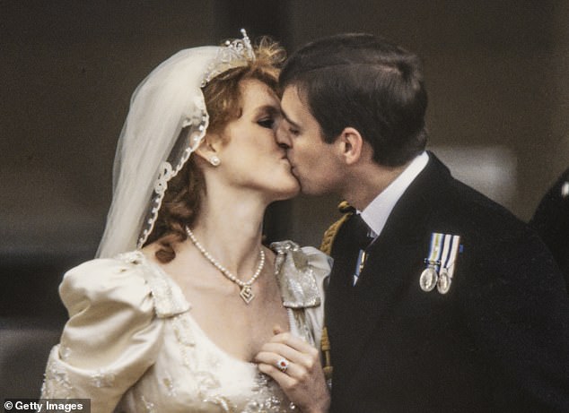 Just-married Sarah, Duchess of York and Prince Andrew, Duke of York as they kiss on the balcony of Buckingham Palace
