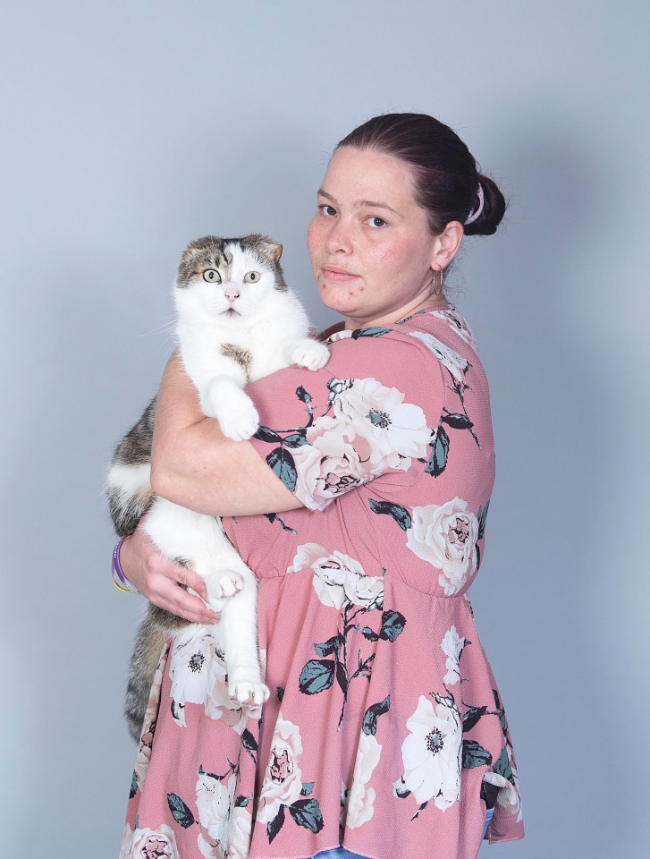 Woman holding a cat.