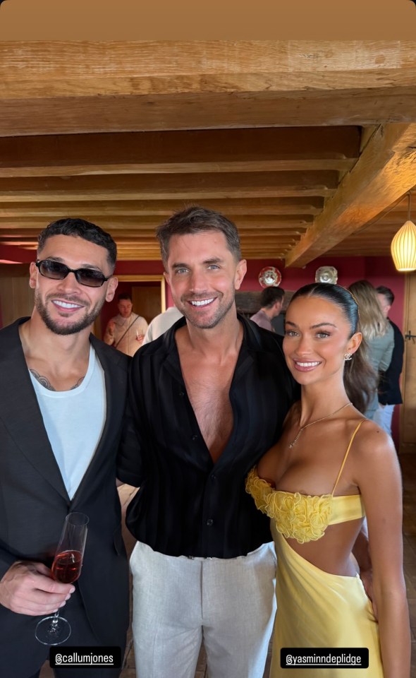 Three people posing for a photo.