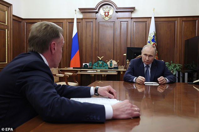 Russian President Vladimir Putin is seen at a meeting in the Kremlin yesterday