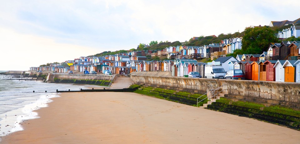Beach huts along a seafront.