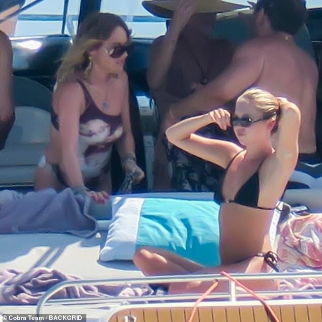 Actress Jaime (L) sizzled in a cut-out swimsuit, pictured with Lila (R)