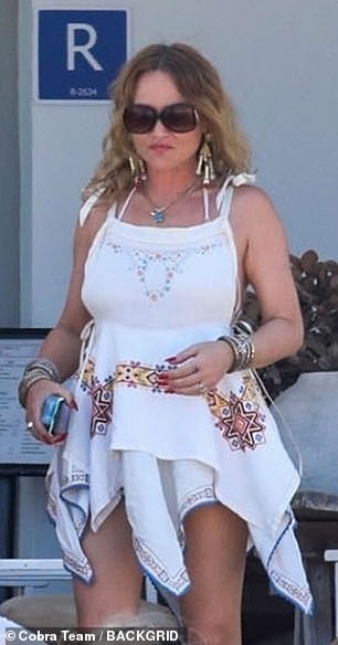 Meanwhile Jaime matched her pal in wore a white leggy mini dress which she teamed with shades