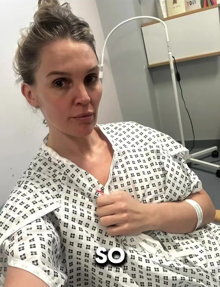 Woman in hospital gown.