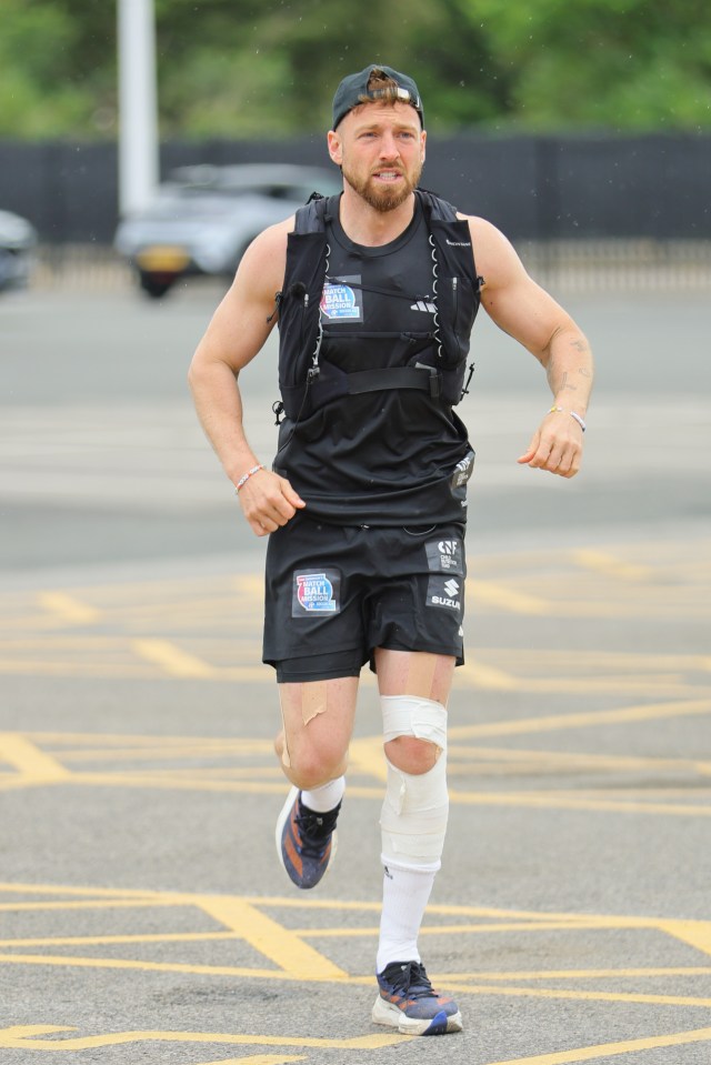 Sam Thompson running, wearing a vest and shorts with Soccer Aid branding.