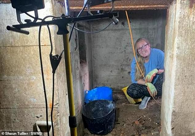 Caroline is pictured inside one of the winding tunnels as they continue work to renovate the bunker