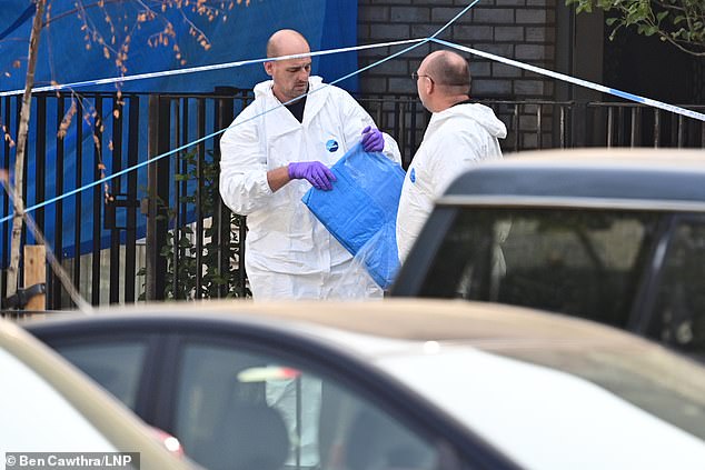 Police forensics work at a crime scene in Kilburn, north west London in August 2020 after the shooting of Jeffrey Wegbe amid the gang feud