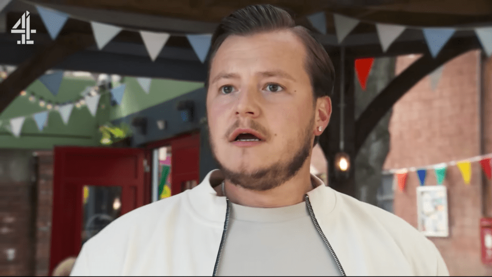 Screenshot of a man speaking outdoors.