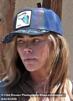 The star looked somber as she stepped out