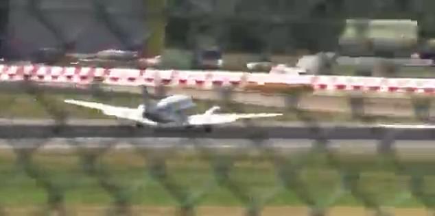 He said: 'I could hear a loud noise which I initially thought was the brakes seizing. I realised, after zooming in, the plane was dragging along'