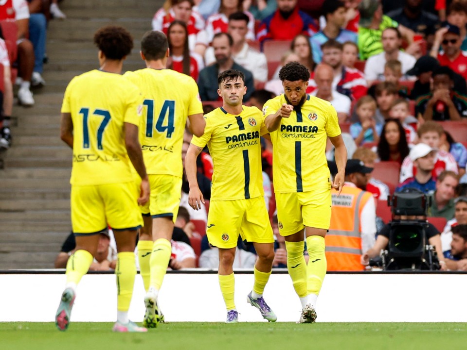 Villarreal's Arnaut Danjuma celebrates a goal with teammates.