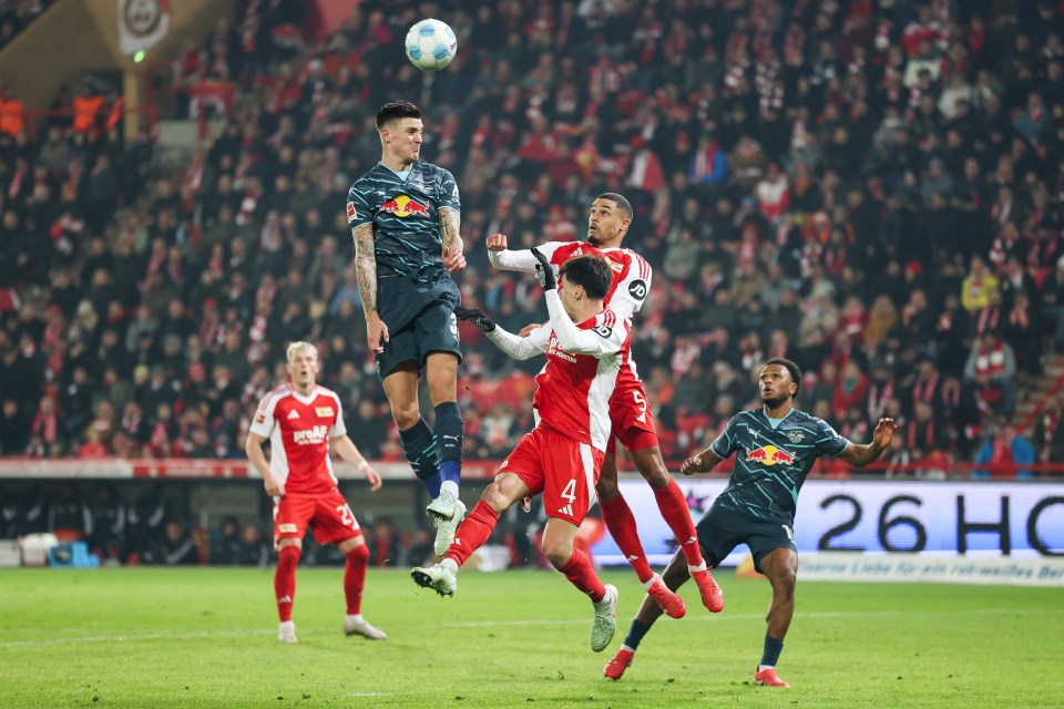 Soccer players vying for the ball.