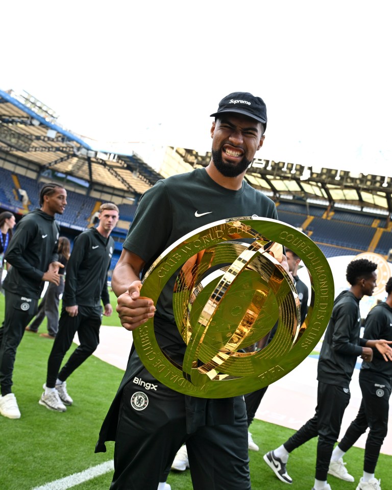 Robert Sanchez of Chelsea holding the Club World Cup trophy.