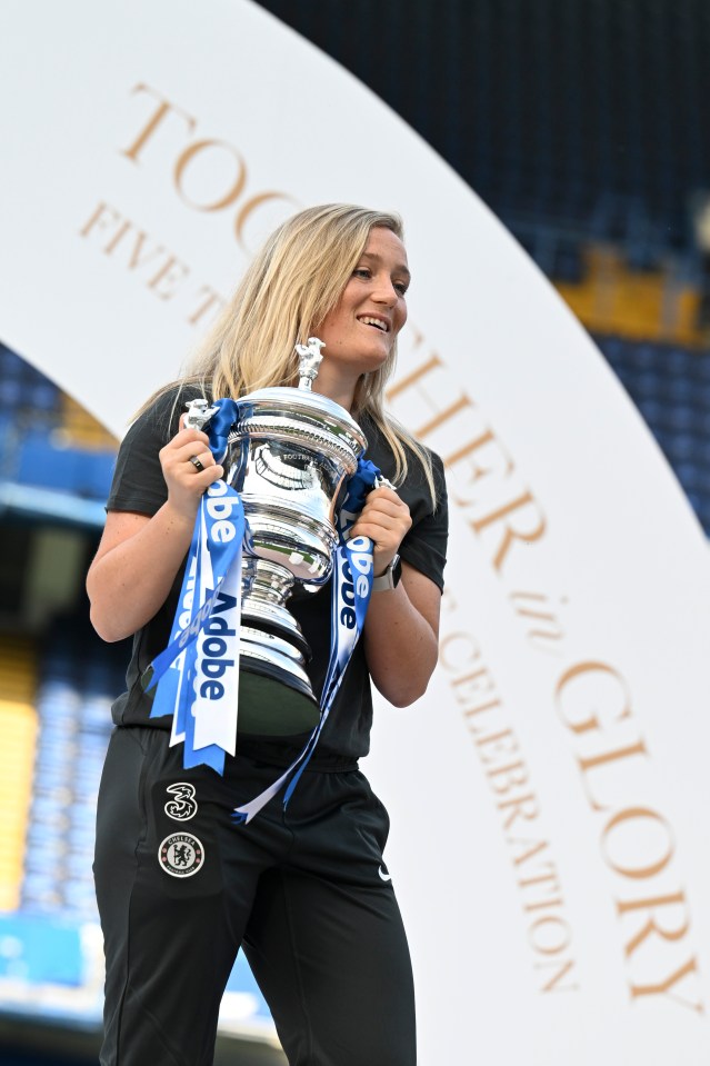 Erin Cuthbert of Chelsea holding a trophy.