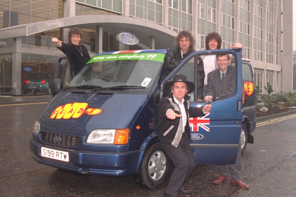 Slade band members with a Ford Transit van.