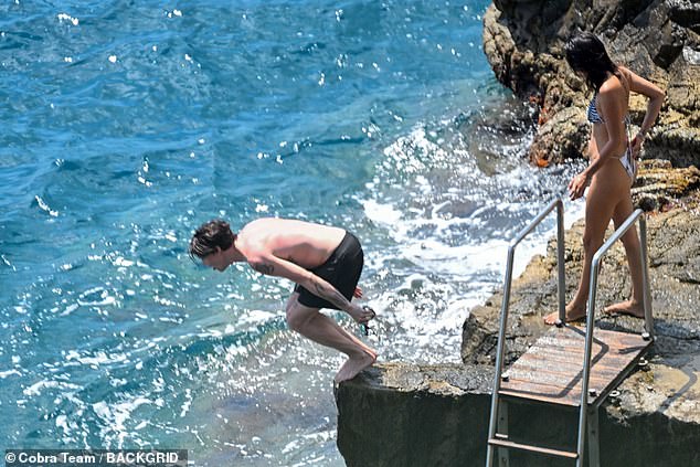 The couple were later seen leaping into the sea