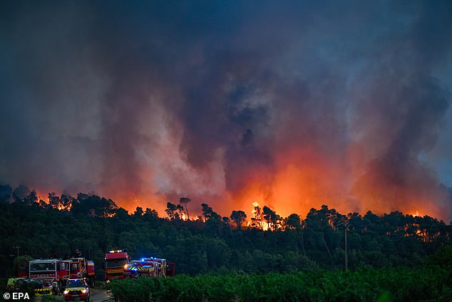 Firefighting crews are deployed to battle a forest fire in Saint-Laurent-de-la-Cabrerisse, Aude department, France, 06 August 2025