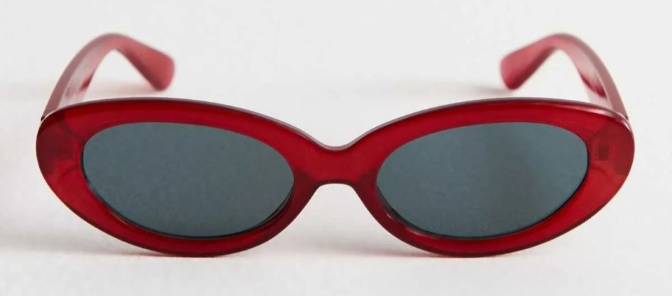 Red oval sunglasses.