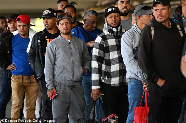 Between January 2021 and October 2023 ¿ during Biden¿s term ¿ US Customs and Border Protection (CBP) recorded encounters with more than 380,000 Venezuelan nationals coming over the US-Mexico border (Pictured: Venezuelan migrants wait in a line at a migrant processing center in Denver in May 2023)