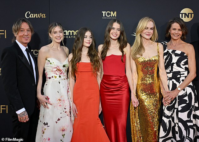 Last year in April, both Sunday Rose (second to left) and her younger sister Faith Margaret (third left) made their red carpet debut at the AFI Life Achievement Award Gala with their parents (seen above)